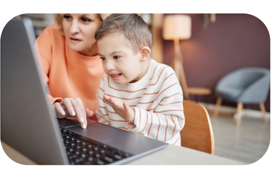 A cild with his mom at a laptop
